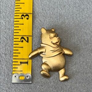 Winnie the Pooh brooch.
